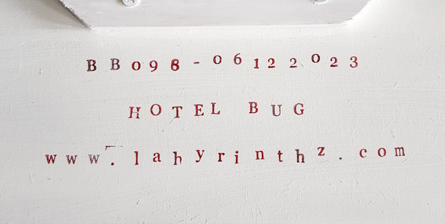 Hotel Bug - signing on the back